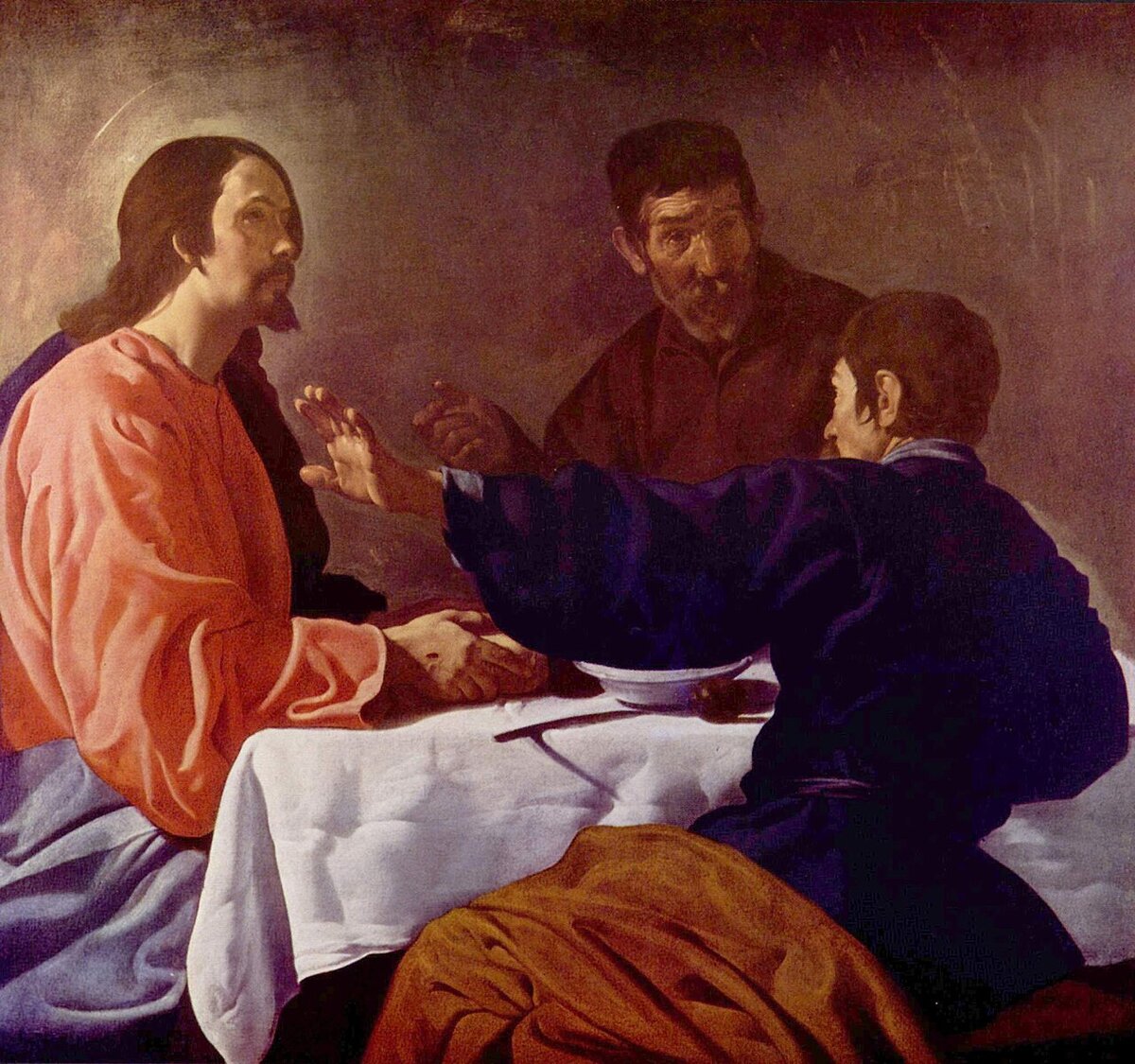 A painting of two figures in conversation across a table, one gesturing and the other listening, in a warm interior