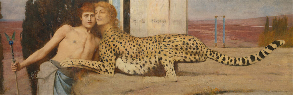 A young man leans against a sphinx with a woman's face and a leopard's body, their cheeks touching in an embrace that is tender and unsettling in equal measure